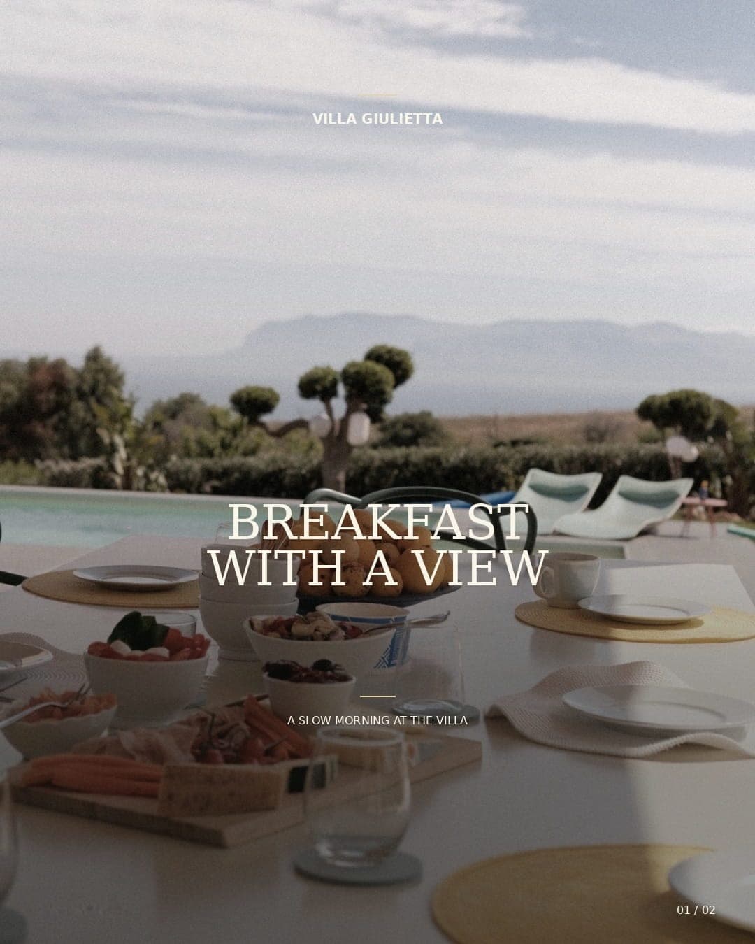 Breakfast table by the pool, sun loungers and the hills on the coast behind, with the words “Breakfast with a view, a slow morning at the villa”